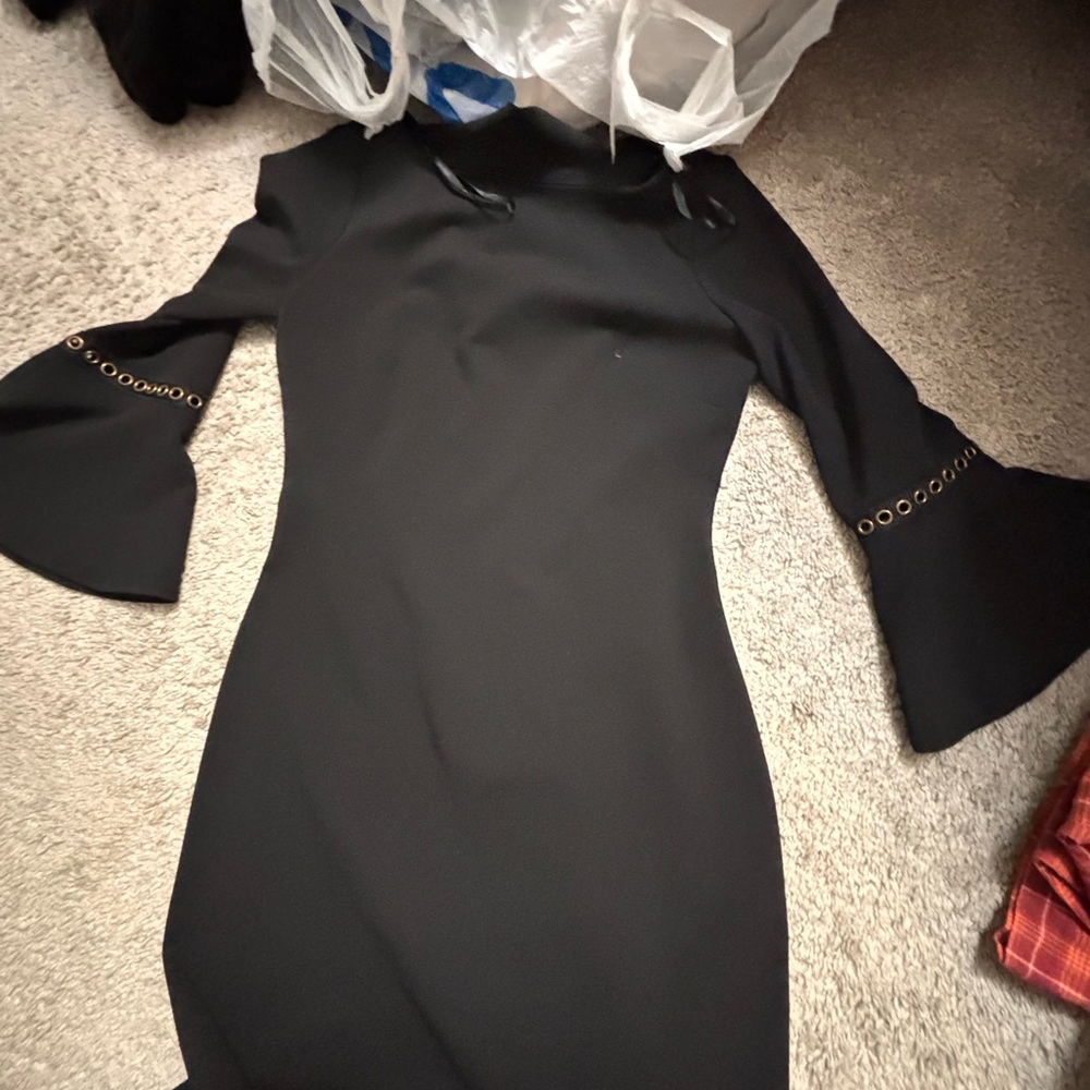 Calvin Klen only used onces Elegant Black Dress with Flared Sleeves